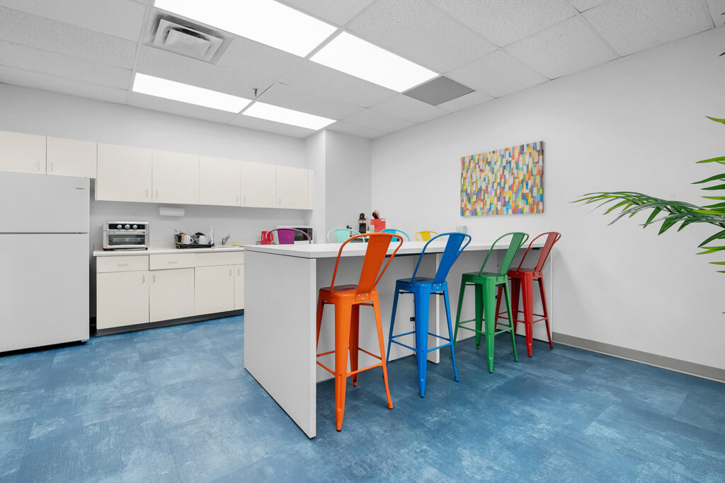 Kitchenette with colourful chairs